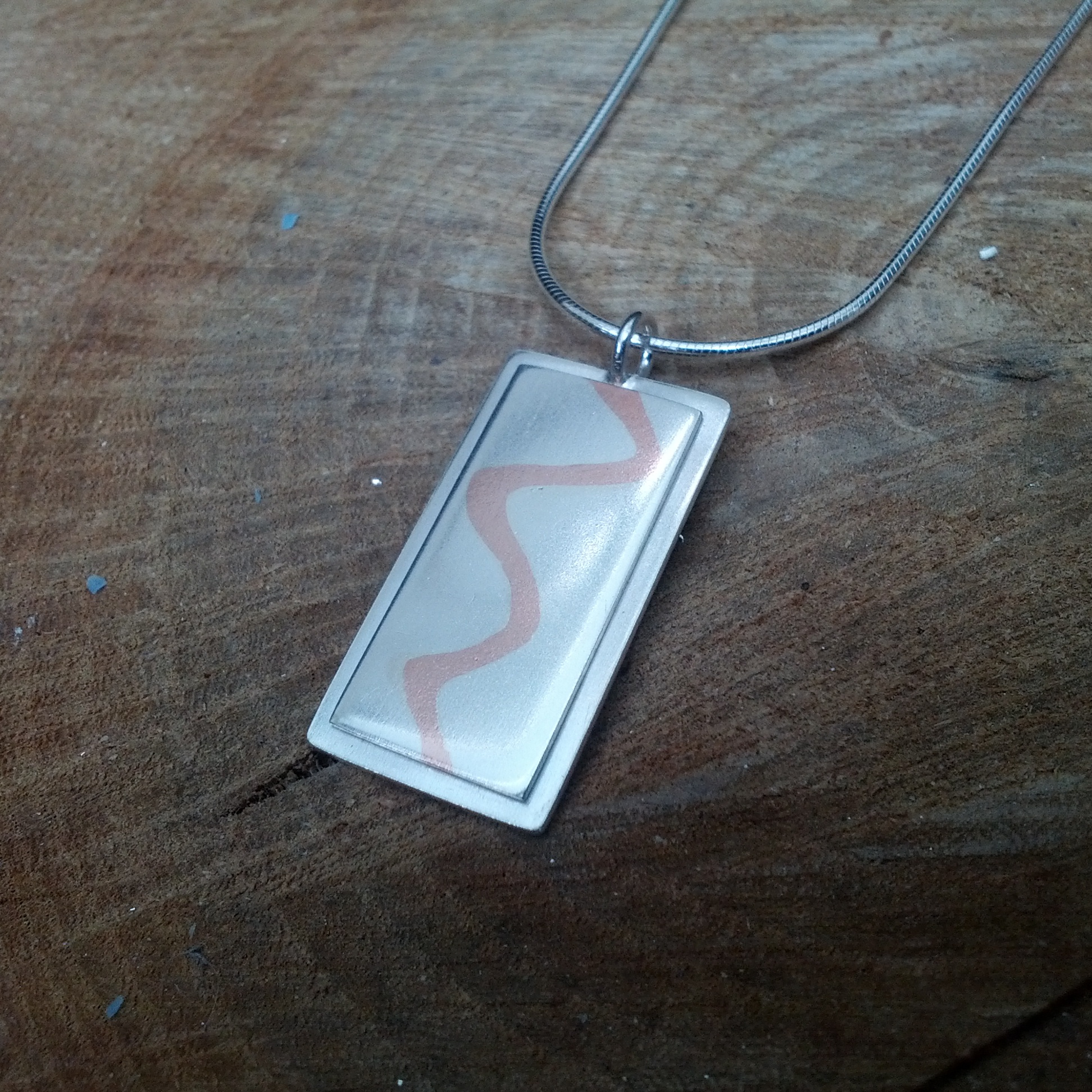 Mixed metal pendant - silver and copper